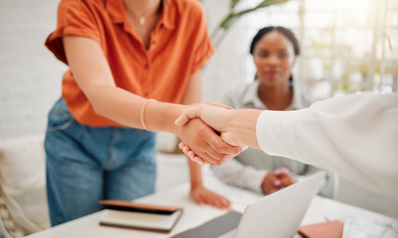 male teacher in his 40s in a classroom with highschool students
