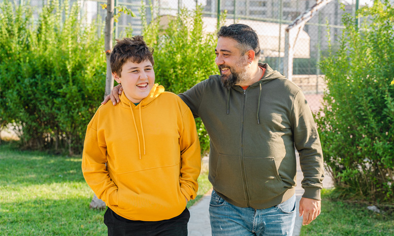 Father and son leaving the basketball court