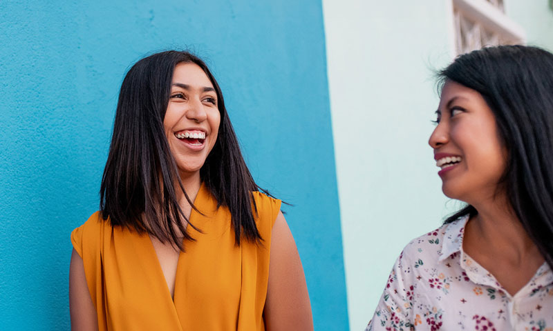 Young Female Teacher Outside With Students Learning